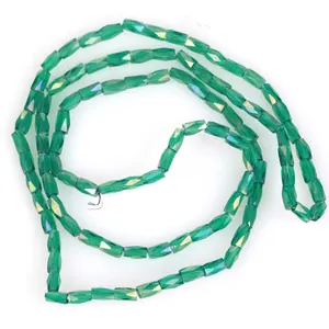 Detailed view of 2x4mm faceted green glass beads for DIY jewelry making
