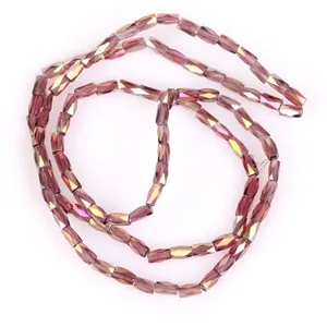Close-up of 2x4mm faceted purple AB crystal glass tube beads for DIY jewelry
