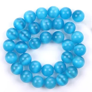 Perline tonde in occhio di gatto sintetico blu brillante per la creazione di gioielli