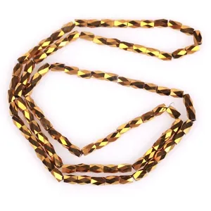 Close-up of golden 2x4mm faceted glass beads strands for jewelry making DIY