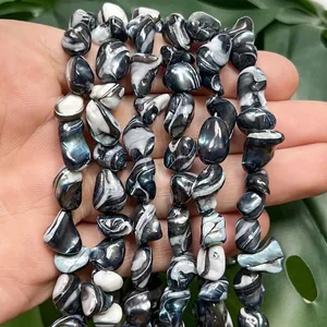 High-detail macro shot of 9-14mm multi-color irregular shell beads for DIY jewelry making