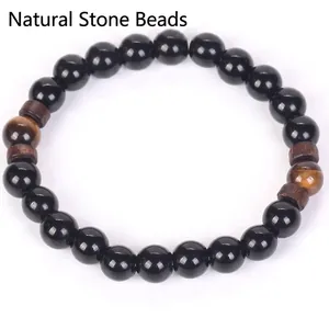 Bracelet ethnique fait main en perles noires mates avec pierres œil de tigre