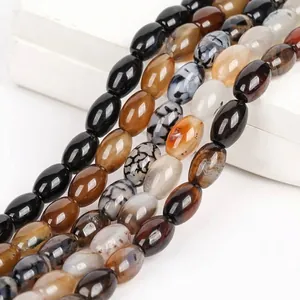 Close-up of natural dragon vein agate rice beads showing unique textures and glossy finish