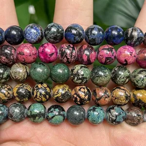 Macro close-up view of multicolored snowflake turquoise beads for DIY jewelry making projects.