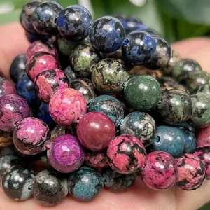 Close-up of multicolor snowflake turquoise beads for DIY jewelry making handmade crafts.