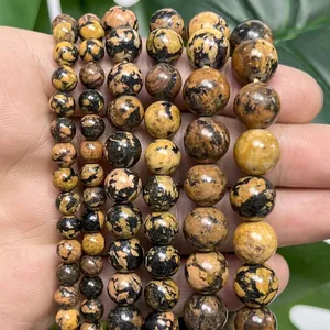Detailed view of natural snowflake turquoise round beads for DIY jewelry making.