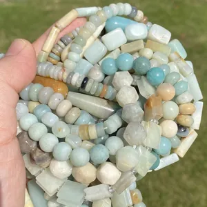 Detailed view of various natural Amazonite stone beads in multiple shapes and colors