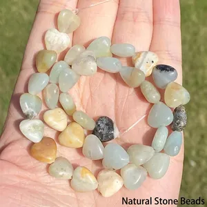 Macro detail of natural heart-shaped Amazonite stone beads for jewelry making