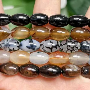 Detailed view of polished dragon vein agate barrel beads for DIY jewelry creation