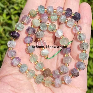 Close-up view of natural faceted rainbow fluorite beads for DIY jewelry bracelet making