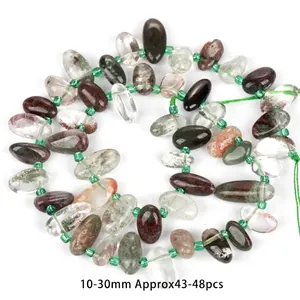 Detailed view of irregular oval natural fluorite beads for DIY jewelry making