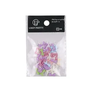 Mini macaron kleur hars strik nail art bedeltjes in verpakking voor DIY nageldecor