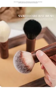 Detail of premium walnut handle nail art dust brush featuring dense and fluffy bristles