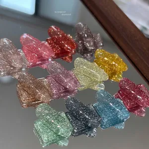 Glittery rainbow diamond nail gel polish collection on reflective mirror background
