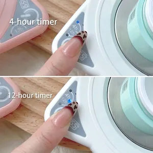 Detailed view of the 4h and 12h timer settings on a white nail polish gel heating pad