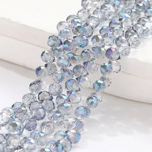 Detailed macro shot of 6mm faceted transparent blue aurora crystal beads for DIY jewelry