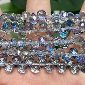 Close-up of 6mm faceted iridescent blue crystal teardrop beads for DIY jewelry making.