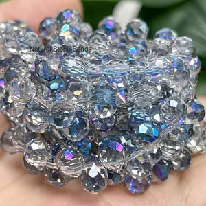 Close-up detail of 6mm transparent faceted crystal beads with iridescent blue shine