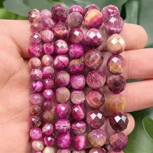 Close-up of faceted pink and purple natural tiger eye stone beads for DIY jewelry