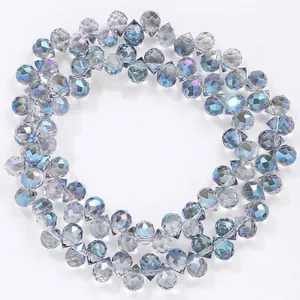 Macro view of 6mm iridescent blue faceted teardrop crystal beads for DIY jewelry crafts