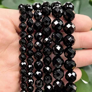 Macro view of black faceted natural agate stone beads for DIY jewelry making