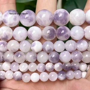 Close-up of purple and white Persian jade round beads for DIY jewelry making