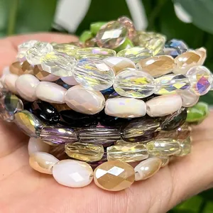 Close-up of 8x11mm faceted egg-shaped crystal loose beads in various iridescent colors.