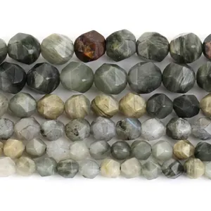 Macro view of multi-faceted natural stone beads showing detailed diamond-cut textures
