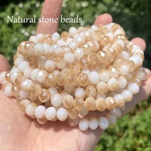 Close-up detail of faceted white and amber imitation crystal beads for jewelry making