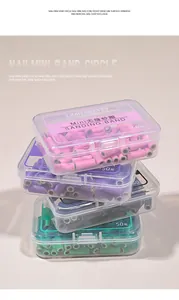 Stack of colorful manicure sanding bands in clear boxes, 50 pieces set for professional nail drills