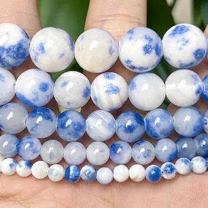 Macro view of blue and white marbled chalcedony round beads for DIY jewelry making
