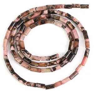 Close-up of 4x2mm cylindrical pink and black Rhodonite natural stone beads for DIY