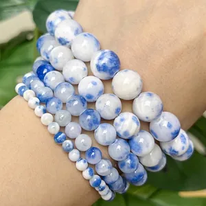 Macro view of blue and white Persian jade chalcedony round beads with natural patterns