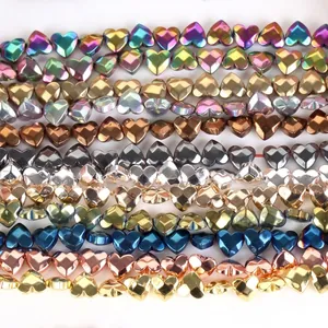Detailed view of faceted heart-shaped hematite beads in multiple metallic colors