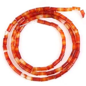 High-quality close-up of 4x2mm orange cylindrical natural stone beads for DIY jewelry making
