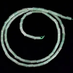 Macro view of 4x2mm cylindrical green natural stone beads for DIY jewelry making