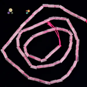 Close-up view of 4x2mm pink cylindrical natural stone beads for DIY jewelry making.