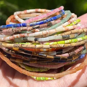 Stack of 4x2mm cylindrical natural stone beads in various colors for DIY jewelry