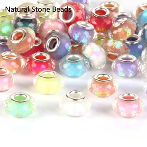 Detailed view of colorful faceted large-hole iridescent beads for DIY charm bracelets