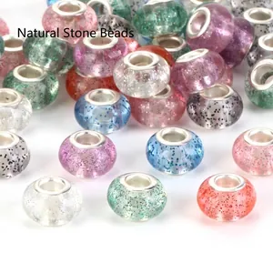 Close-up of assorted colorful glitter large-hole beads for DIY jewelry bracelets