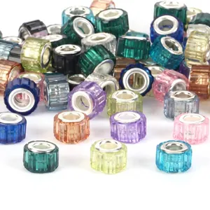 Detailed macro view of colorful faceted large-hole barrel beads for DIY bracelets