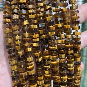 Close-up detail showing texture of 4x8mm faceted natural tiger eye stone abacus spacer beads