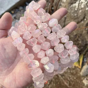 Close-up of natural faceted rose quartz beads with transparent pink crystal texture