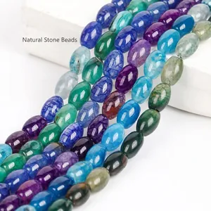 Macro view of oval dragon vein agate beads in vibrant mixed colors for DIY jewelry.