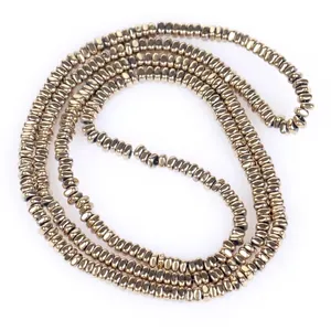 Macro view of 2x1mm golden flat square hematite beads strand for DIY jewelry making