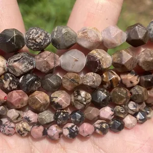 Close-up of natural rhodonite and pink stone faceted beads for DIY jewelry making