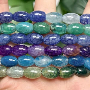 Macro detail of multi-color dragon vein agate rice beads showing unique cracked texture.