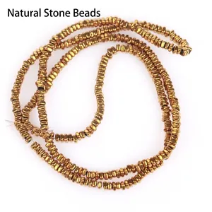 Detailed view of 2x1mm golden hematite flat square beads for DIY jewelry crafting.