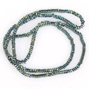 Close-up of 2x1mm iridescent hematite flat beads for DIY jewelry making projects.