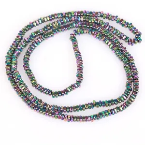 Detail of 2x1mm iridescent flat hematite beads with center hole for DIY jewelry.